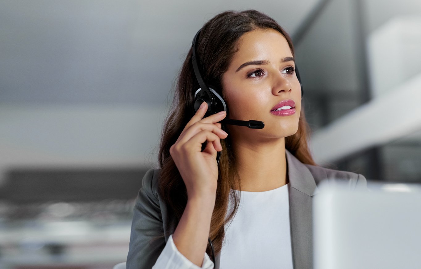 Handling Some Customer Inquiries. Shot of a Young Call Centre Ag