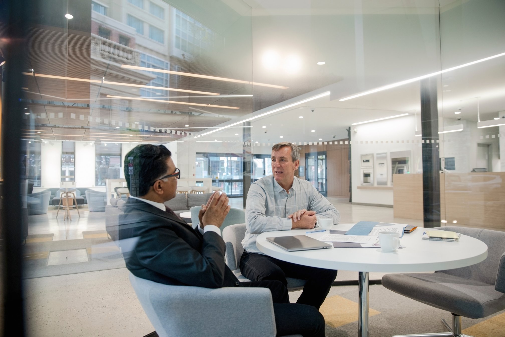 Loan manager meeting with client in bank branch office