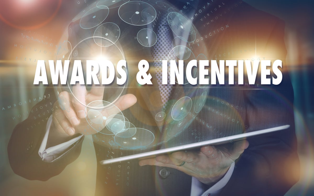 Awards and Incentives business concept on a futuristic computer display.