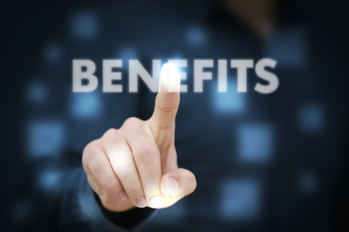 Businessperson's Hand Touching the Word Benefits