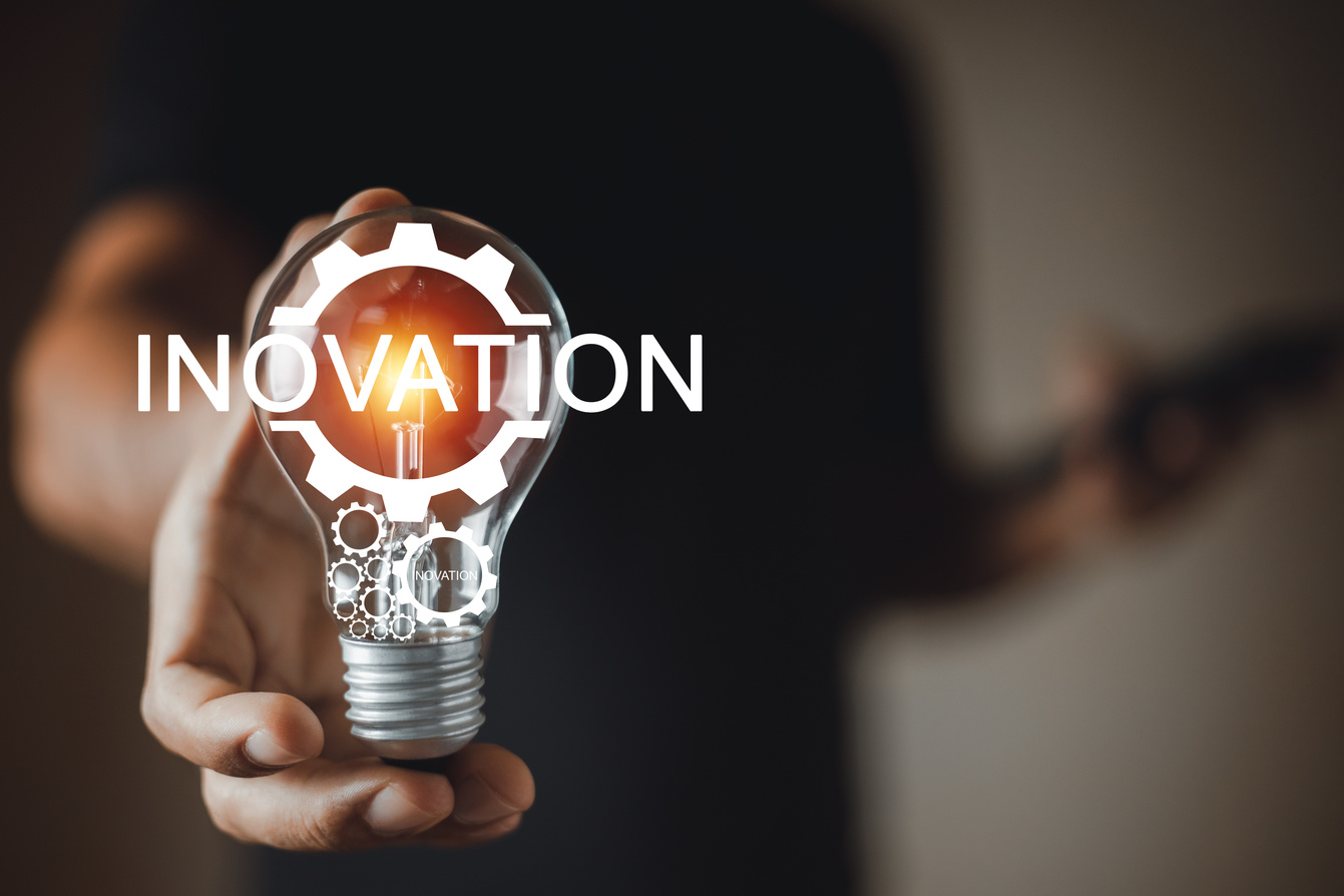 Technology innovation concept. Hand holding light bulbs with Innovation text icon. Business learning inspiration creativity. network connection technology industrial.