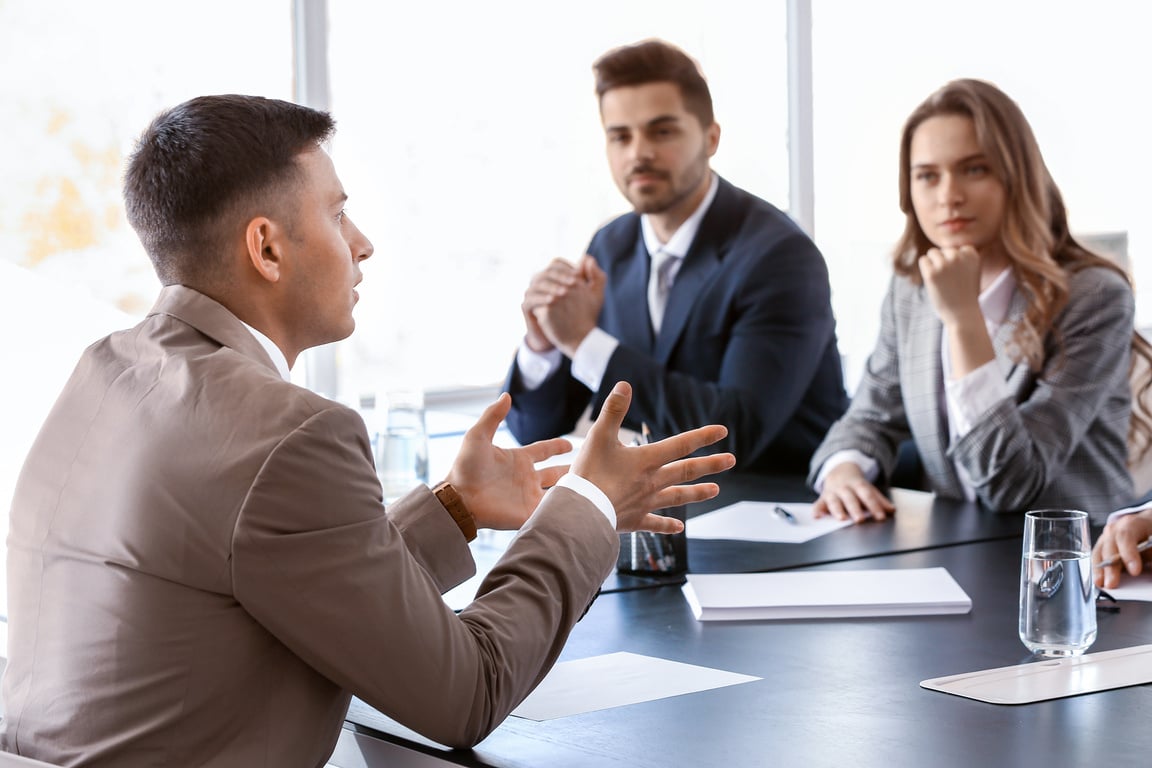 Human Resources Commission Interviewing Man in Office