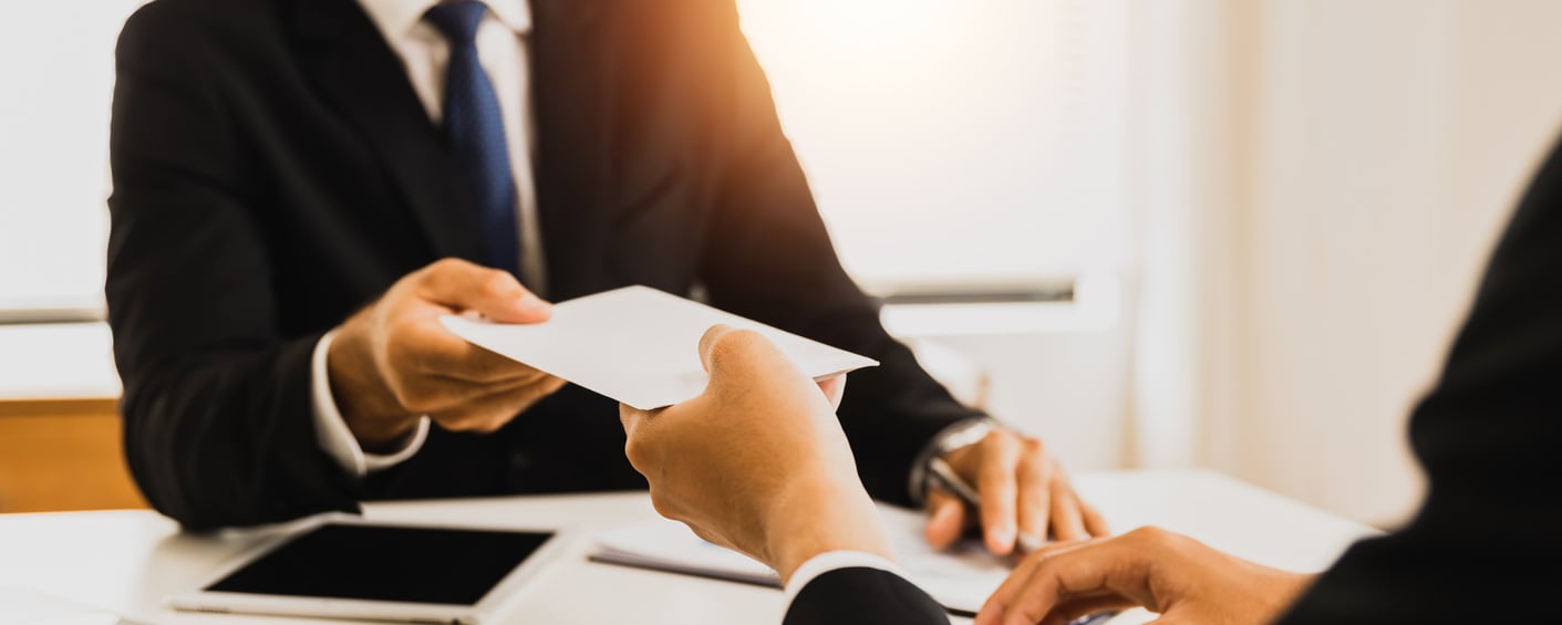 close up hand of employee receive bonus from manager