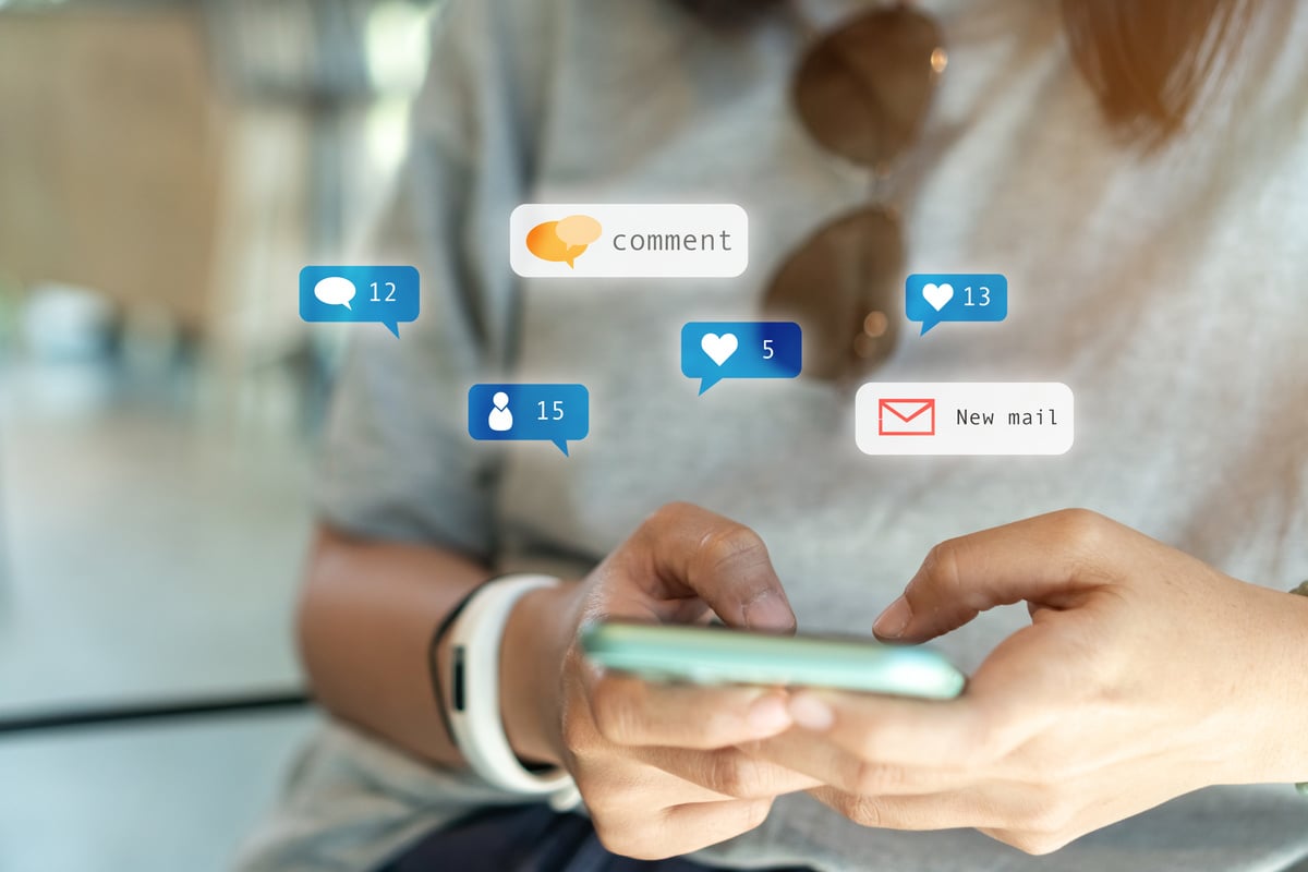 Hand Holding Smartphone with 3D Notifications