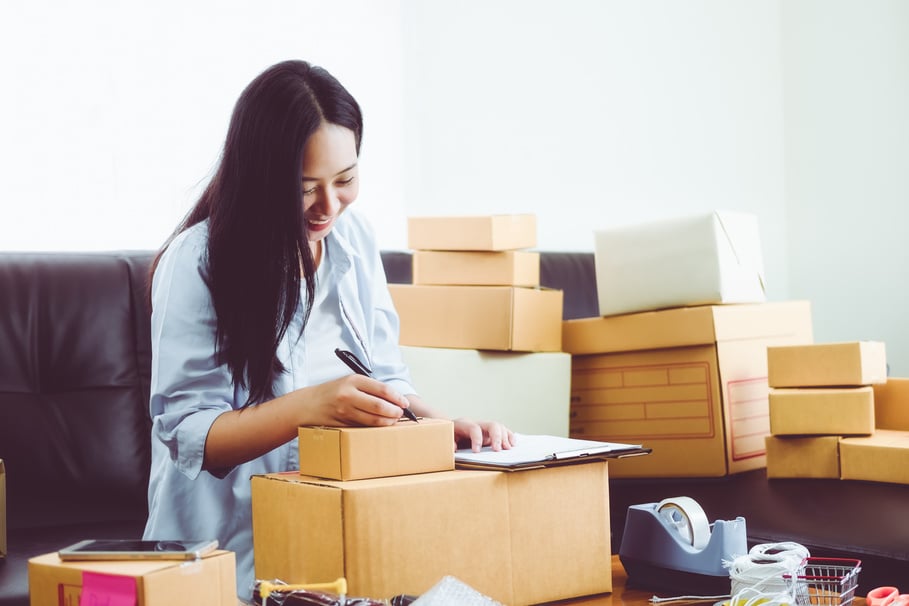 Merchant Doing Online Business and Packing Orders