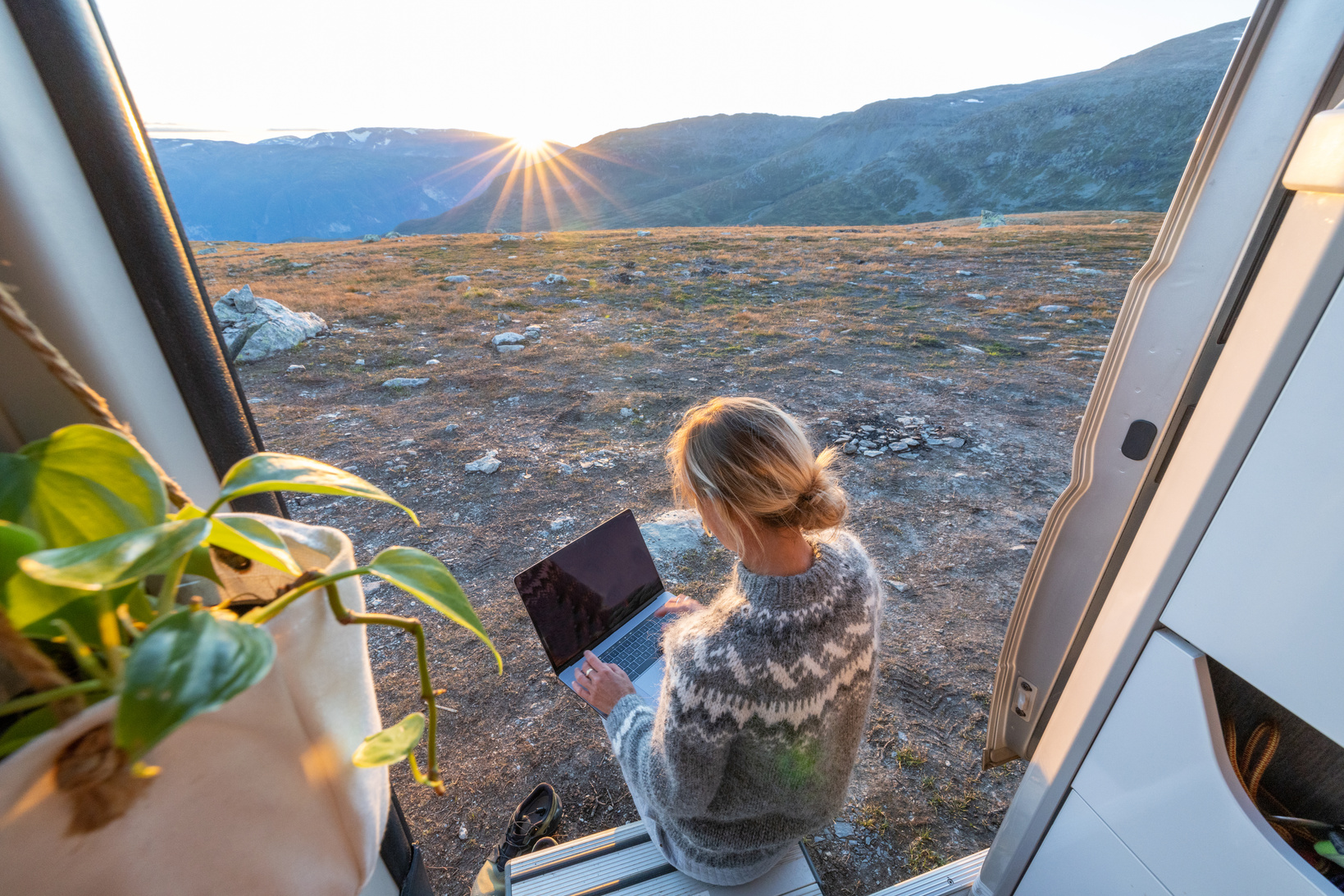 Woman working remotely, van life concept