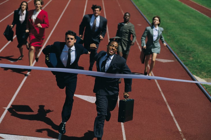Businesspeople Racing to the Finish Line