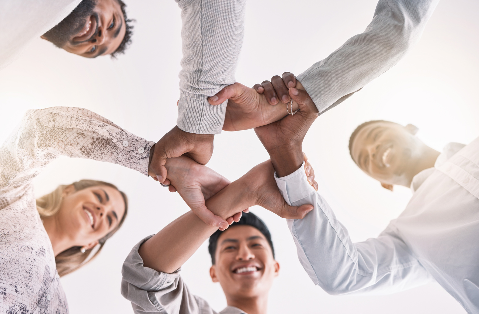 Teamwork Hands, Wrist and Unity in Collaboration, Motivation and Support for Success, Vision and Goals. below of Happy, Diversity and Solidarity Staff in Partnership, Cooperation and Trust Together