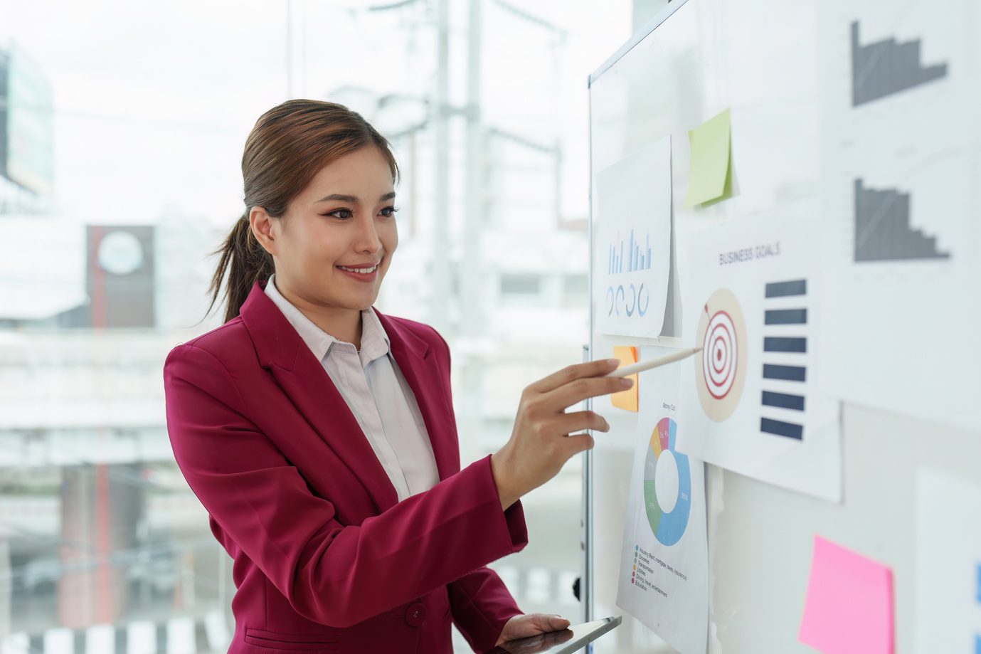 Business leader pointing at goals plan and analyze financial data for long term investments