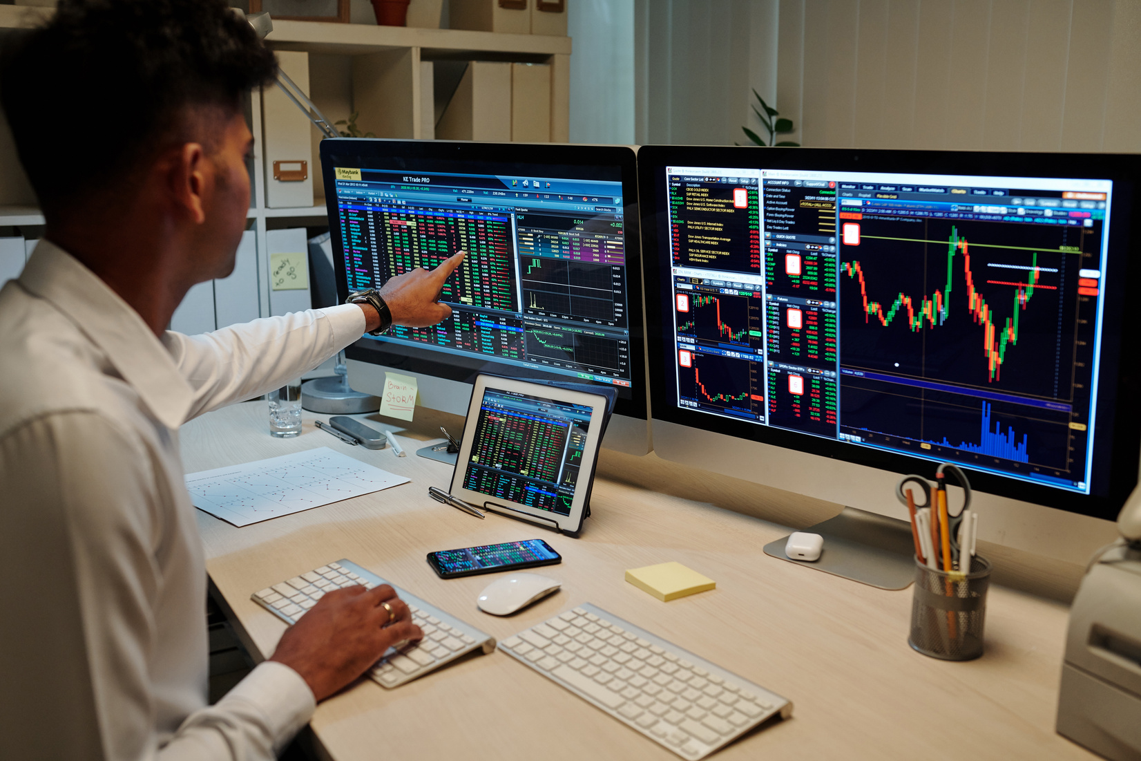 Indian Trader Working in Dark Office