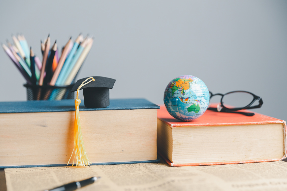 Graduation cap with Earth globe. Concept of global business study, abroad educational, Back to School. Education in Global world, Study abroad business in universities in worldwide. language study
