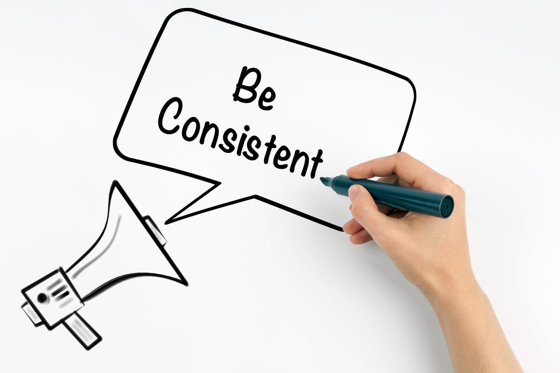 Be Consistent. Megaphone and text on a white background.